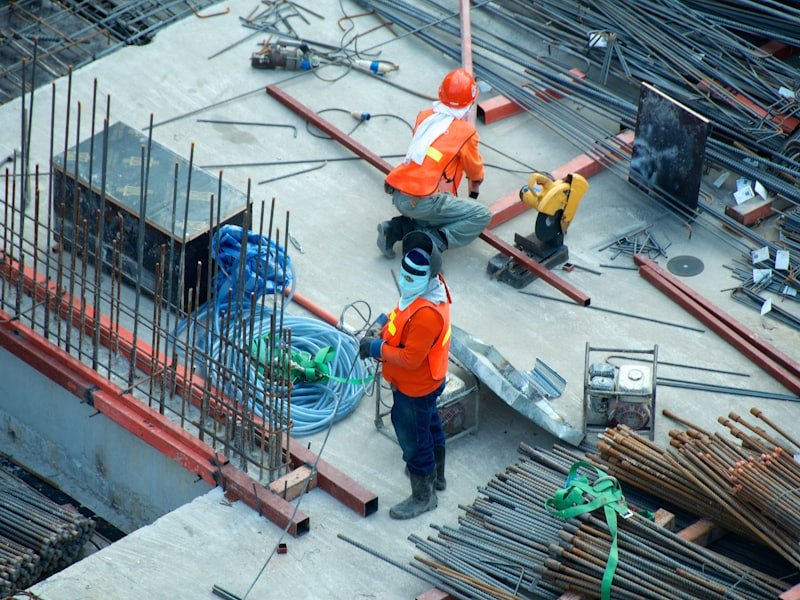 Site operatives installing services and drainage runs