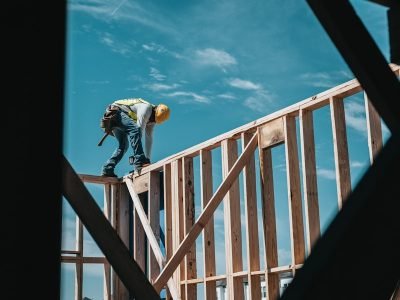 Carpenter working on a timber frame roof structure