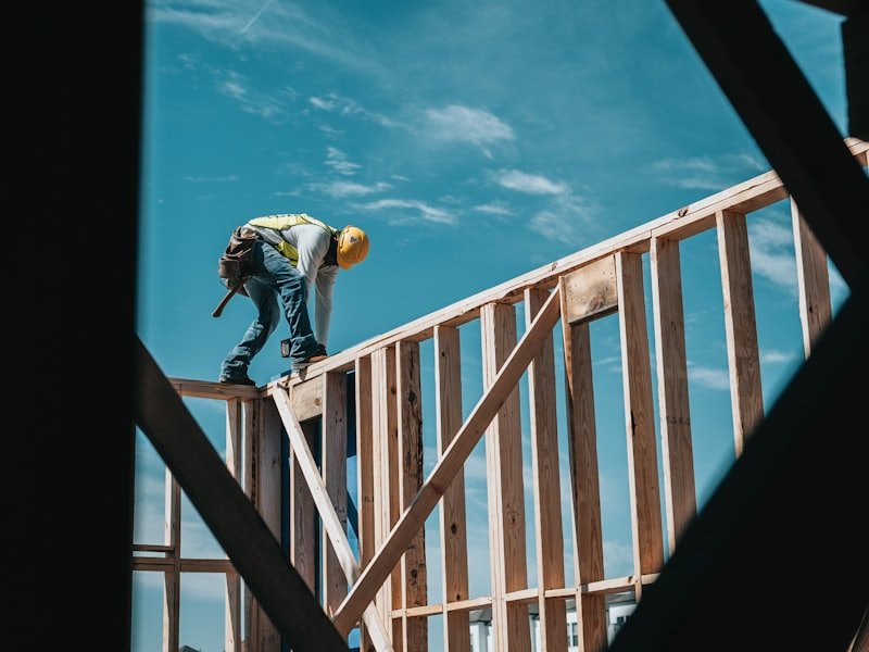 Carpenter working on a timber frame roof structure