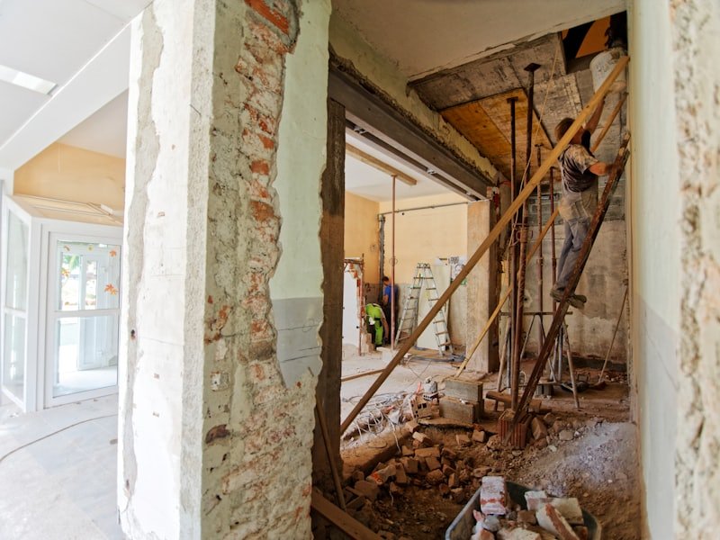 Interior of a property mid-refurbishment with walls stripped back